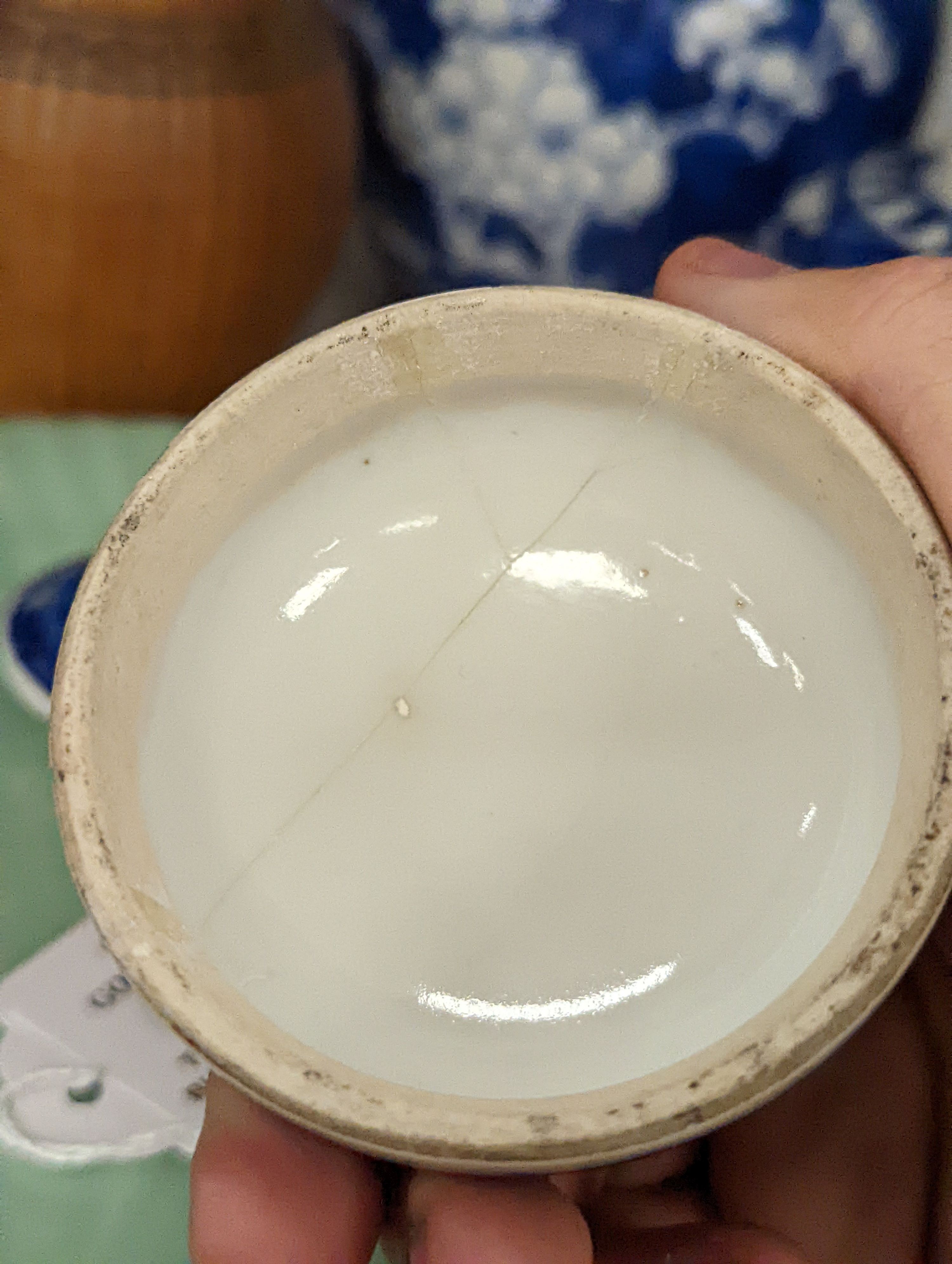 Three Chinese blue and white ginger jars and covers, a celadon plate and bamboo covered vase (5)
